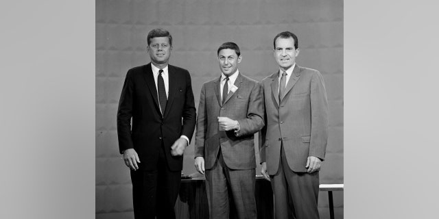 Sen. John F. Kennedy (left), Don Hewitt of CBS News (center) and Vice President Richard M. Nixon (right) at the first televised presidential debate on Sept. 26, 1960. 