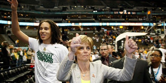Brittney Griner (42) and Head Coach Kim Mulkey of Baylor University celebrate after defeating the University of Notre Dame during the Division I Women's Basketball Championship held at the Pepsi Center in Denver, CO.  Baylor defeated Notre Dame 80-61 to win the national title.  