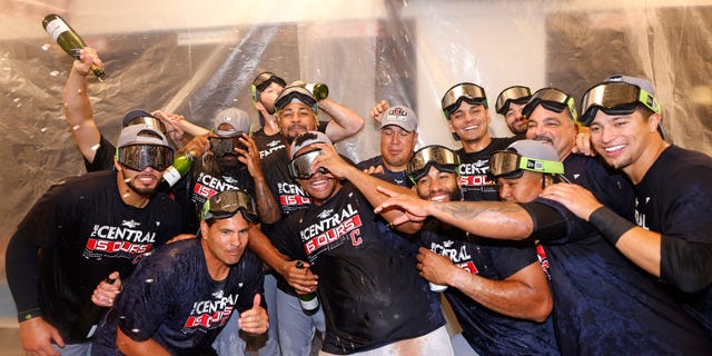 The Cleveland Guardians celebrate after they defeated the Texas Rangers 10-4 and clinched the American League Central Division at Globe Life Field Sept. 25, 2022, in Arlington, Texas.