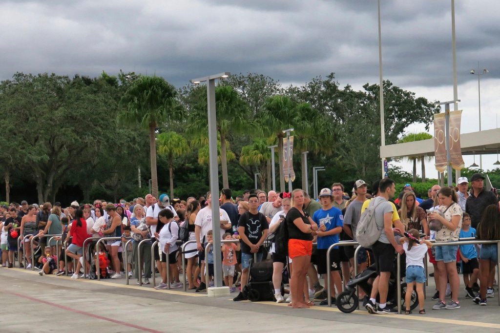 Guests wait for tram transportation at the Magic Kingdom at Walt Disney World after the park closed early.