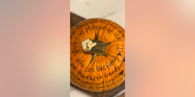 This gratitude pumpkin says, among other things, "I am thankful for friends who are like family." Another message: "I am thankful for freedom."