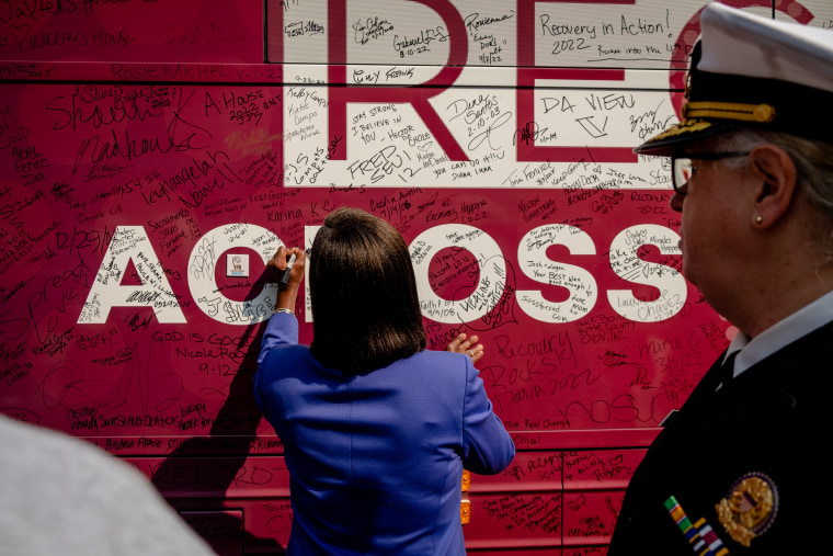 A woman signs the Mobilize Recovery bus in Washington, D.C.