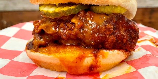 Prince's Hot Chicken sandwich. Nashville hot chicken traces its roots to Thornton Prince, a Depression-era Nashville pig farmer and local lothario. A spurned lover attempted to punish him by over-spicing his fried chicken. He loved the new dish so much he began selling it.  