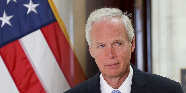 Sen. Ron Johnson (R-WI) arrives at a news conference.