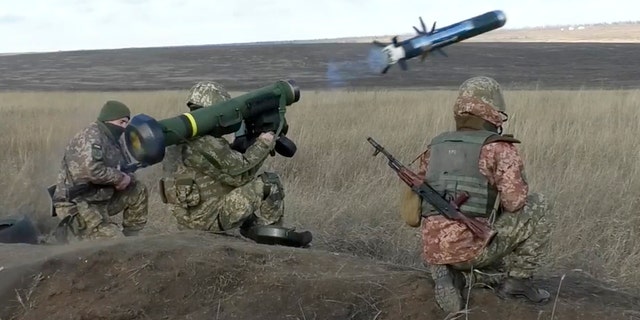 Ukrainian soldiers use a launcher with U.S. Javelin missiles during military exercises in Donetsk region, Ukraine, Wednesday, Jan. 12, 2022. (Ukrainian Defense Ministry Press Service via AP)