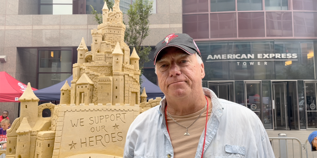 Professional sand sculptor Matt Long stands in front of his artwork during an interview with Fox News Digital at the Tunnel to Towers annual 5K in New York City on Sunday, Sept. 25, 2022.