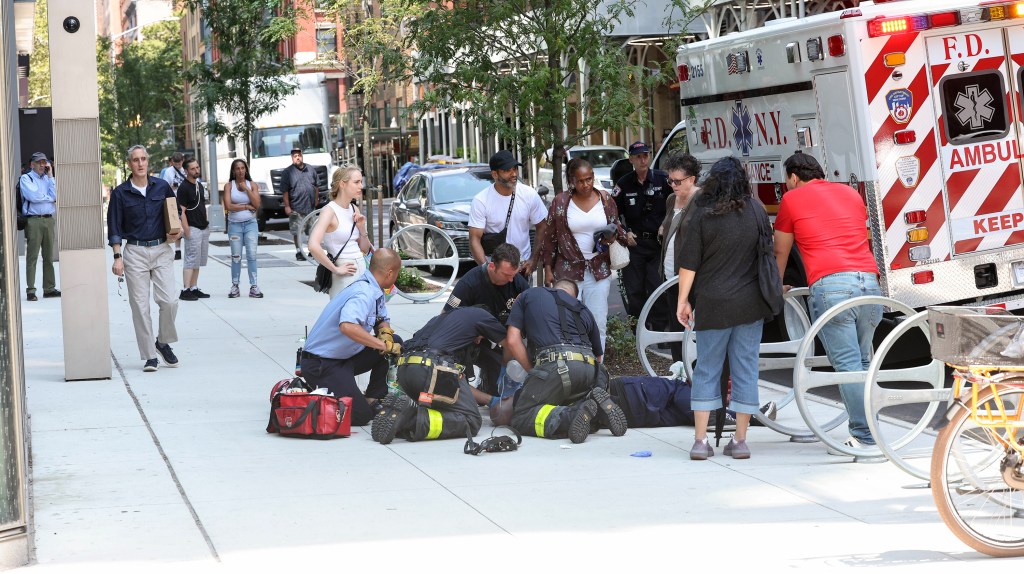 Photo of people responding to a medical emergency. 