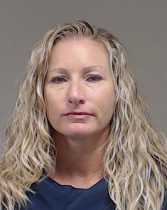 Assistant coach Kasie Ostrom was jailed Tuesday and has since made bond.